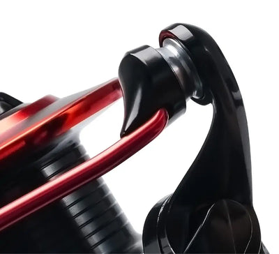 Close-up of black spinning reel reel seat and red handle arm
