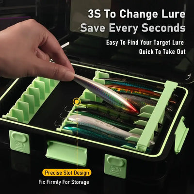 Open lure storage box with green dividers and lure rows, closed by a hand