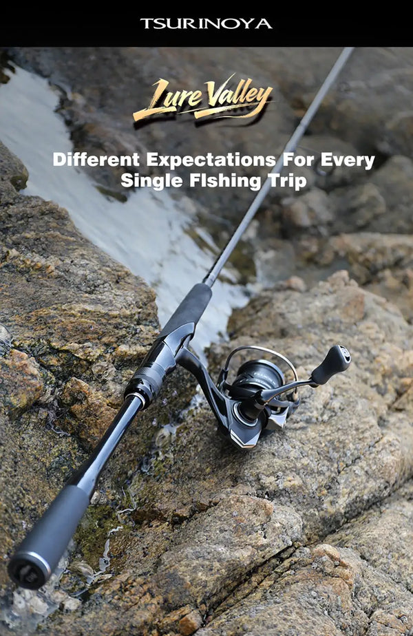 Packable lure rod with spinning reel, black rod resting on rocks near water