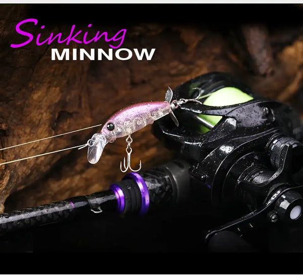 Sinking minnow fishing lure in translucent pink and chartreuse with treble hooks.