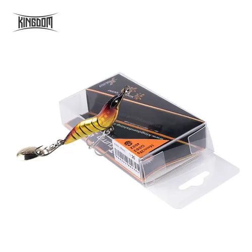 Metal spinner shrimp fishing lure in clear retail box, yellow-gold body with spoon blade