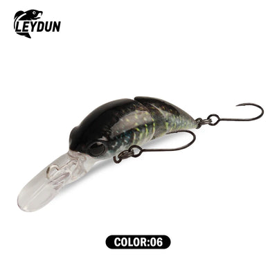 Floating minnow crankbait lure, dark gray with green pattern and clear tail, two treble hooks