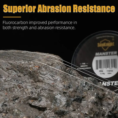 Fluorocarbon fishing line on rocky surface with spool in the background