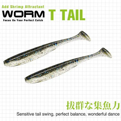 Two dark gray T-tail soft plastic shad lures with blue speckles