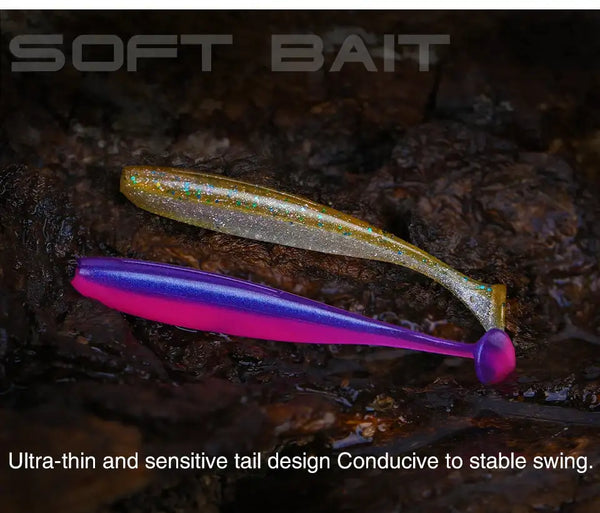 Glitter green soft plastic shad lure with purple T-tail and rounded head.