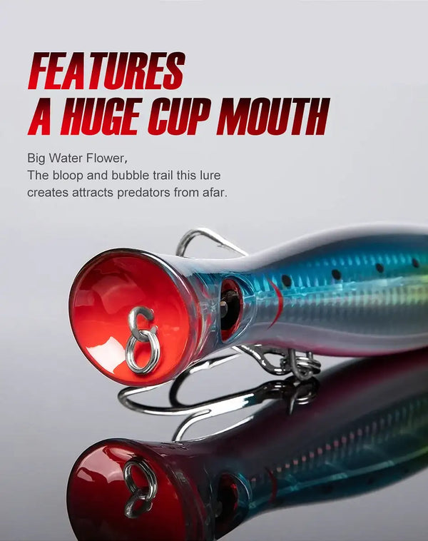 Topwater popper lure close-up, red cupped mouth with blue-green body and treble hooks