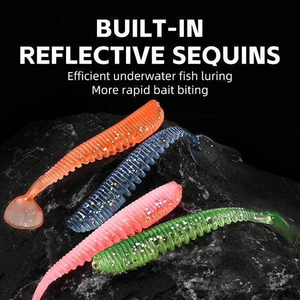 Reflective soft shad lures, orange, blue, and pink bodies with sparkly finish