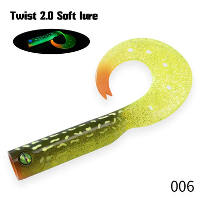 Olive-green soft fishing lure trailer with orange fin, speckled silicone tail