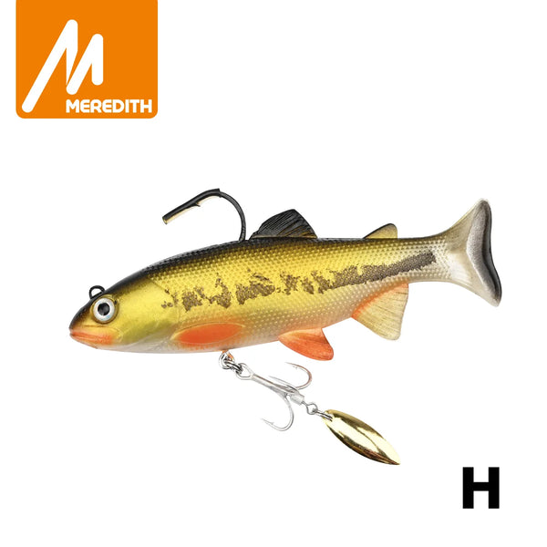 Soft swimbait lure with yellow-green body and dark speckles, treble hook and spinner blade