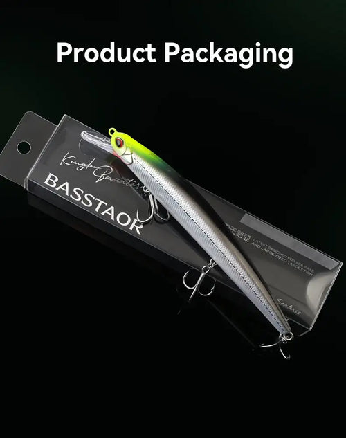 Fishing lure in retail packaging, green-silver minnow style with treble hooks