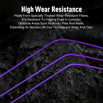Purple braided fishing line strands running over dark textured surface