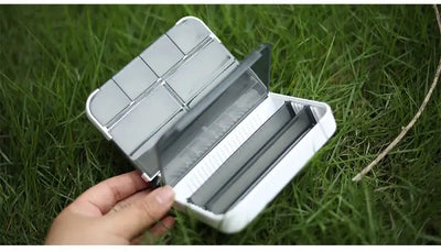 Mini fishing tackle box storage case, white, open with hinged lid and divided compartments