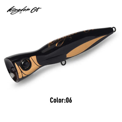 Black and tan popper fishing lure with black eye and side hook