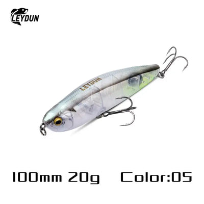 A sleek 100mm silver translucent leydun z-claw floating pencil stickbait with gold eye and three treble bkk hooks