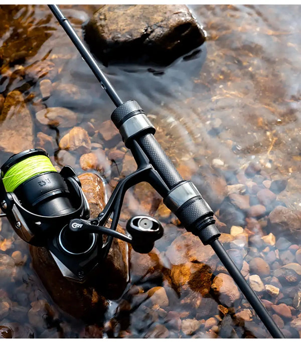 Light game fishing rod with EVA grip, paired with spinning reel on stream bank