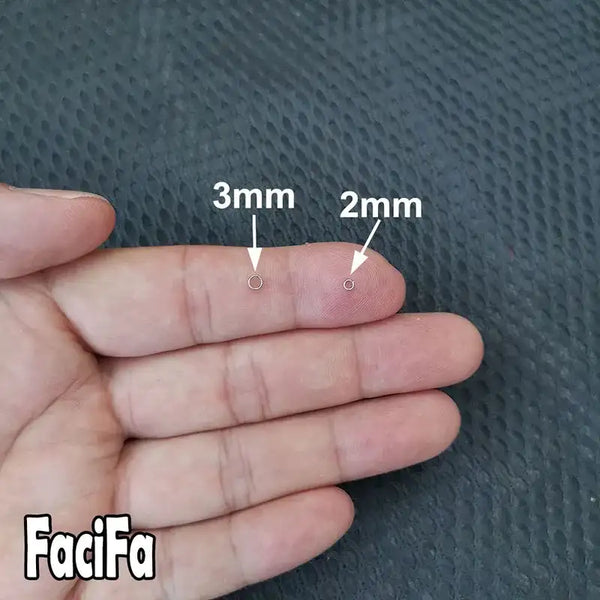 Stainless steel split rings, 2mm and 3mm sizes shown on fingers