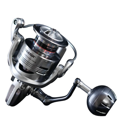 Spinning fishing reel with silver body, black handle, and round front drag dial