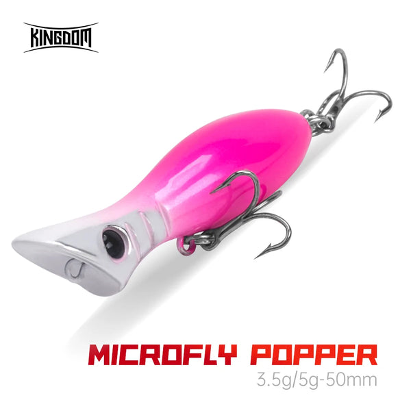 Pink and white open-mouth popper fishing lure with treble hooks