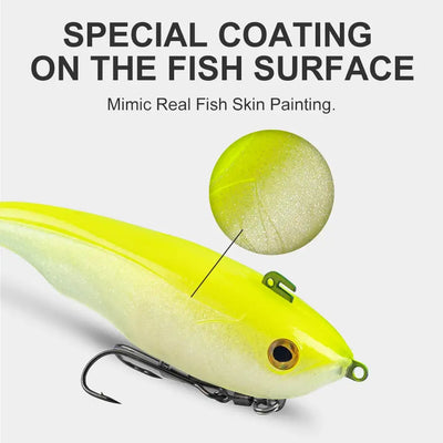 Lime-yellow sinking soft T-tail lure with speckled coating and double-hook jighead