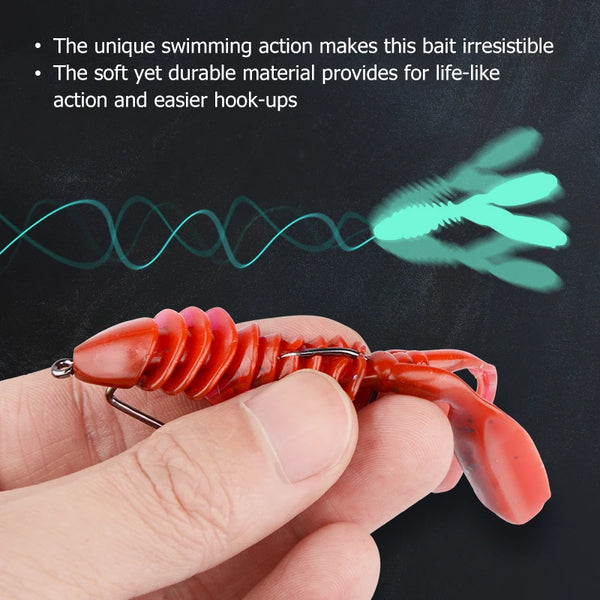 Red translucent silicone jigging lure worm held in hand with metal hook loop