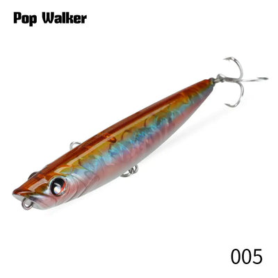Orange and silver popper fishing lure with treble hooks, glossy hard bait