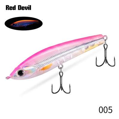 Topwater pencil fishing lure, pink and silver with multiple treble hooks.