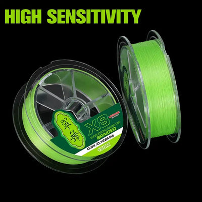 Green braided fishing line spool with extra spool beside it