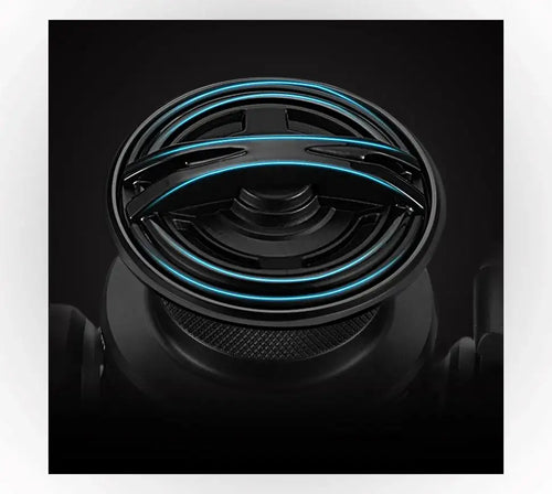 Black spinning fishing reel spool face with teal accent ring detail