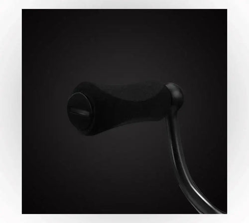 Black spinning fishing reel handle knob and crank arm close-up
