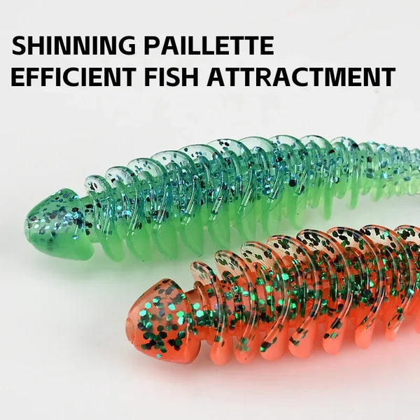 Glittery green and orange paddle T-tail soft plastic lures with speckles