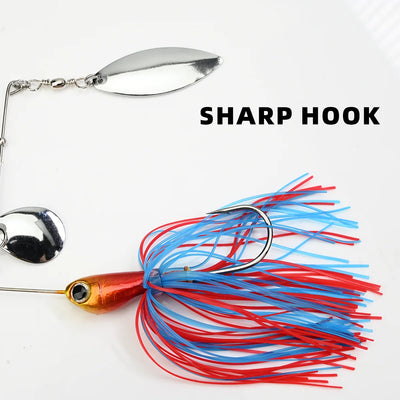 Red-orange spinner swim jig with blue/red skirt and sharp hook, silver spinner blade