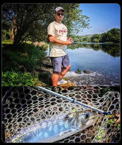 Fishing rod with silver fish in landing net, held over a lakeside