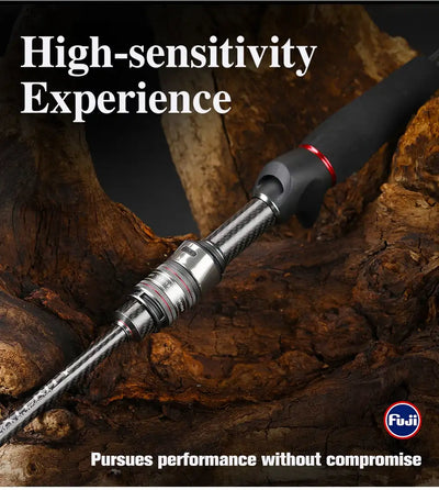 Ultralight spinning rod with black handle and red accent rings, resting on rocks.