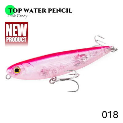 Floating pencil fishing lure in pink with gold eye and treble hooks