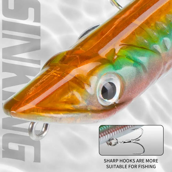 Orange and green pencil topwater lure close-up with large front eye and treble hook
