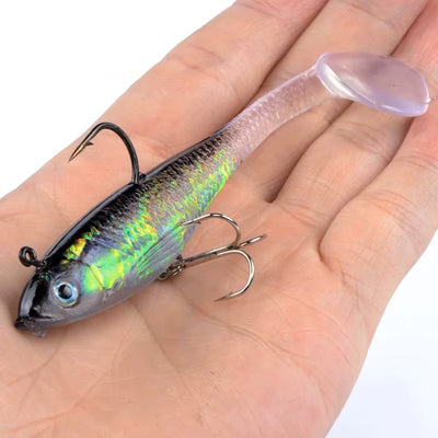 Luminous purple/blue fishing lure with treble hooks, held on an open palm