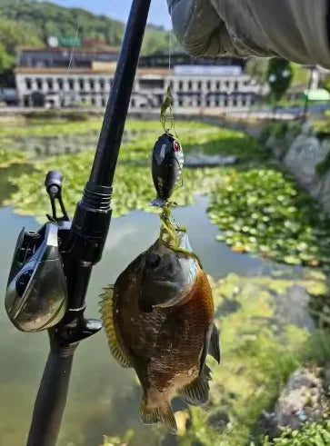 Topwater wobbler lure on fishing line with black body and treble hooks