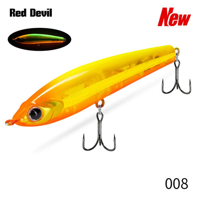 Topwater pencil fishing lure, orange and yellow with multiple treble hooks.
