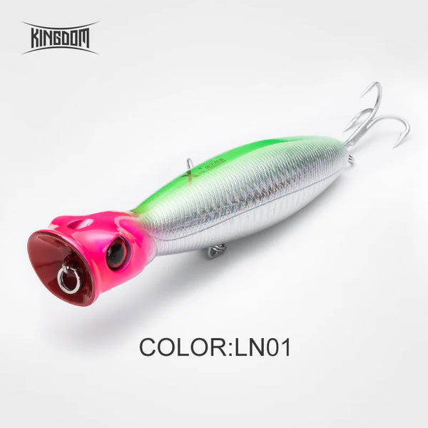 Single floating hard fishing lure, green-and-white body with pink head, treble hooks.