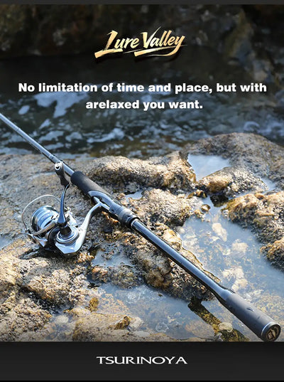 Packable lure rod with spinning reel, black rod on rocky shore