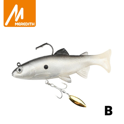 Soft swimbait lure with gray back and silver sides, gold spinner blade and treble hook