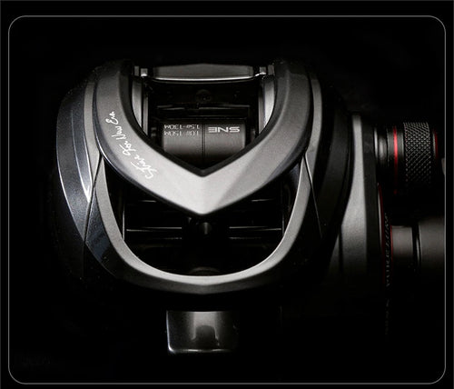 Baitcasting fishing reel side view with casting brake housing and spool area