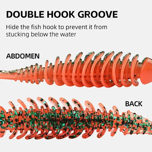 Orange paddle tail soft plastic lure close-up of ribbed body and dual grooves