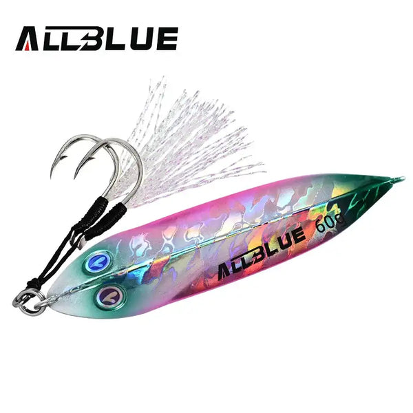 Metal jigging spoon with iridescent green-purple finish, silver feather tail, two treble hooks.