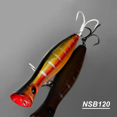 Orange, red, and yellow striped topwater popper hard bait with treble hooks