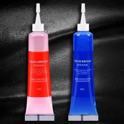 Two squeeze tubes of reel maintenance lubricant oil: red liquid and blue solid grease