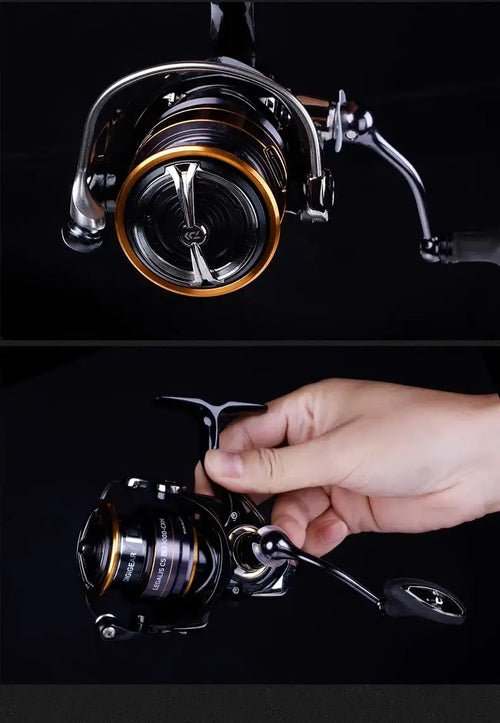 Black and gold spinning reel with silver handle, shown being operated by a hand