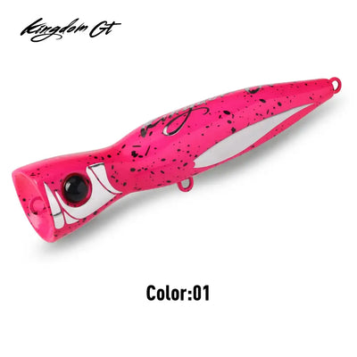 Pink topwater popper fishing lure with black speckles and treble hook hardware