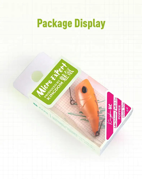 Fishing lure package display showing orange lure and colorful product cards