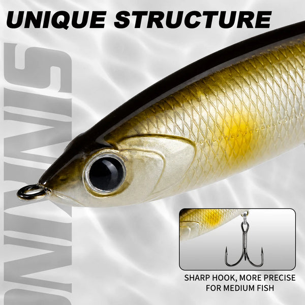Gold topwater pencil lure with circular eye detail and front treble hook